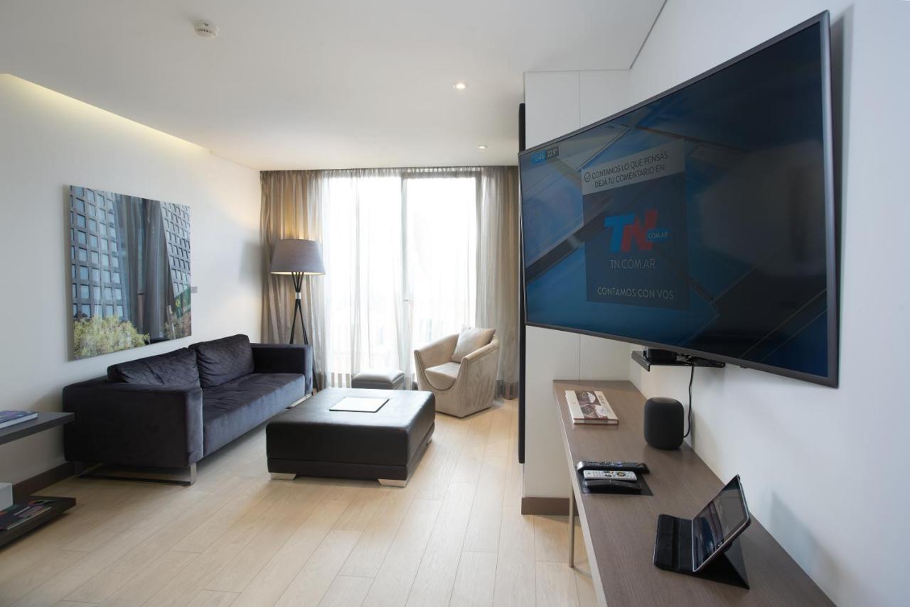 Hotel 100 Luxury Suites By Preferred Bogotá Exteriör bild A television set in a hotel room